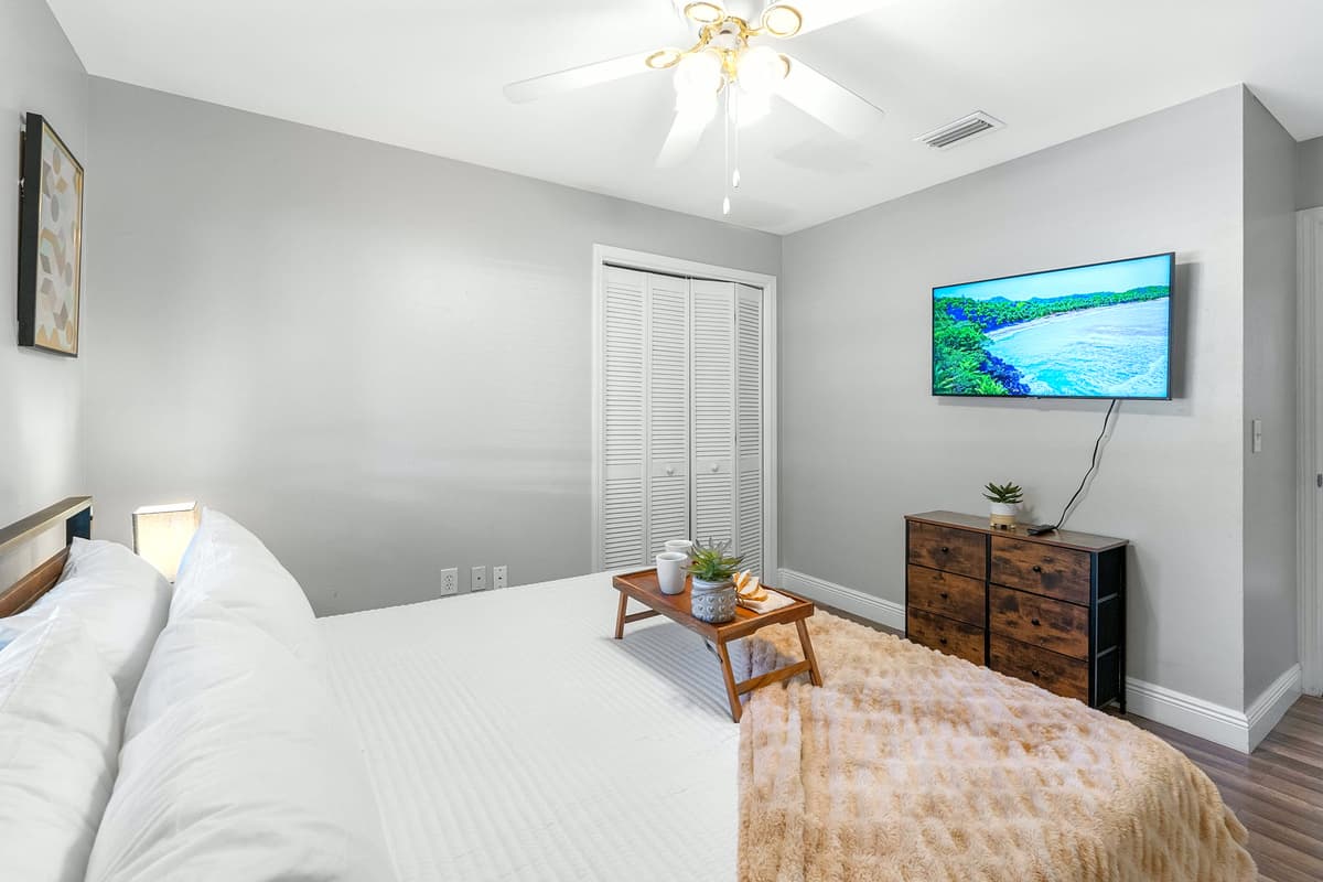 Cozy textures, minimalist décor, and a king bed make this room feel like home.