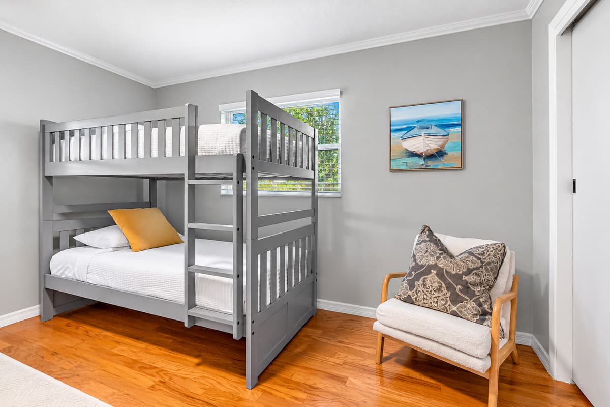 Perfect for the kids or a group of friends, this bright bunk room sleeps four comfortably with two twin-over-twin bunk beds.