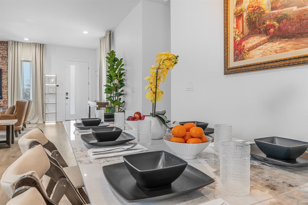 Elegant dining table setup with modern place settings and decorative accents, perfect for shared meals.