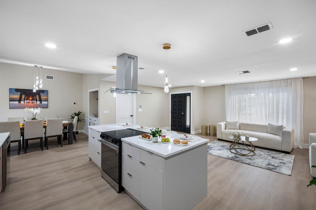 Neutral tones, soft lighting, and minimalist design give this kitchen a spa-like calm.