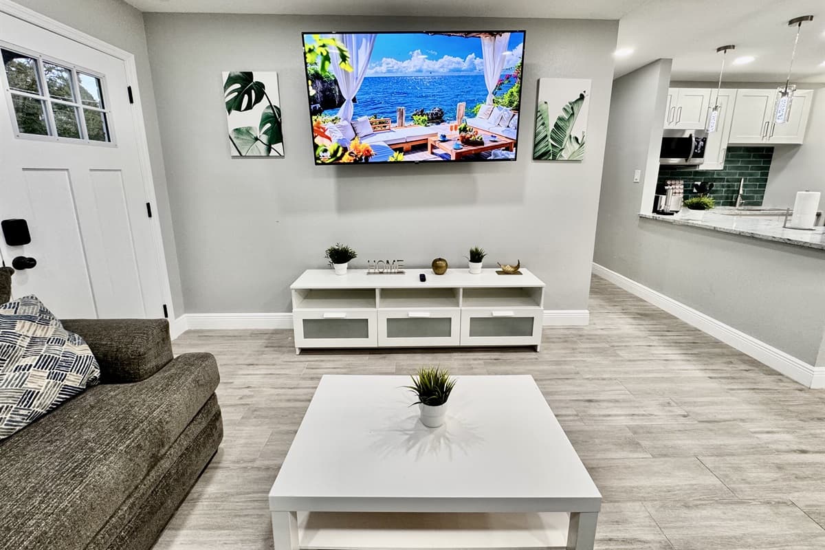 A large smart TV takes center stage, mounted on the wall or perched on a stylish entertainment console.