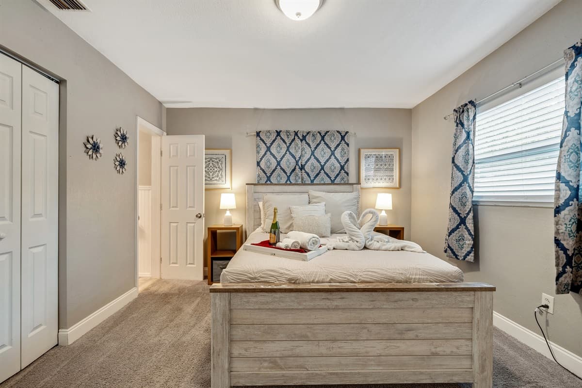 A regal queen-size bed takes center stage, inviting you to surrender to its embrace after a day of adventures or a night of blissful dreams.