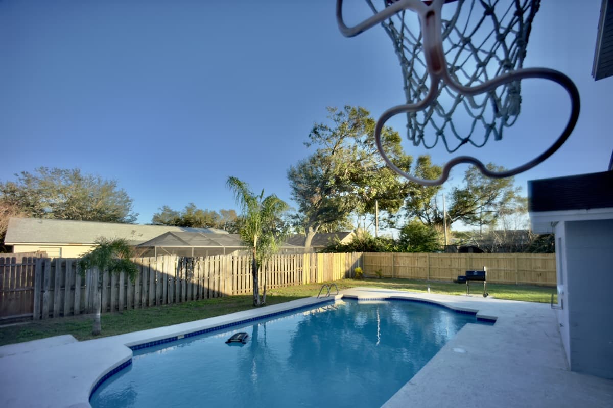 Step into a backyard oasis with a private pool, ideal for cooling off or basking in the sun. Challenge your friends to a game on the poolside basketball court, then gather around the BBQ grill for a perfect outdoor feast.