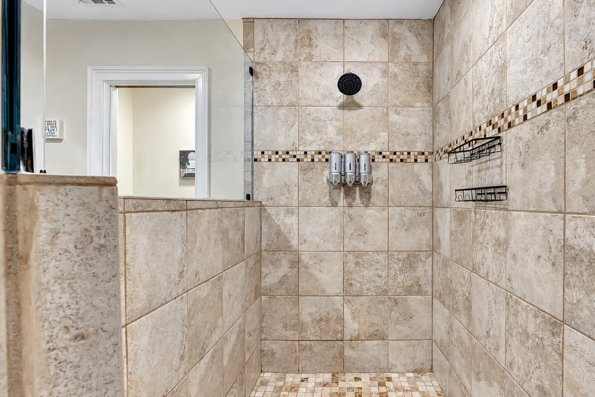 The walk-in shower beckons with its modern allure, providing a spa-like experience.