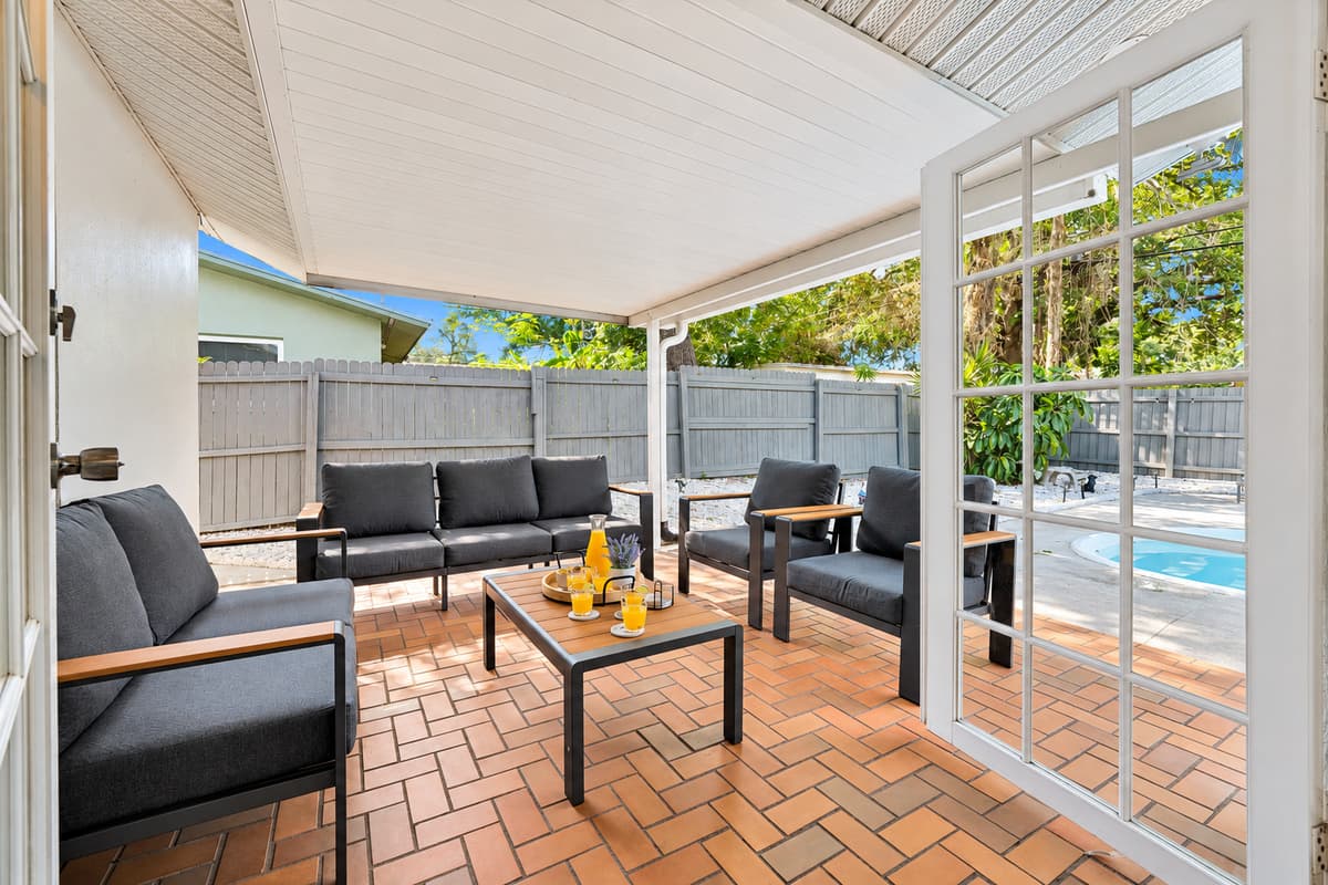 Morning coffee, afternoon shade, evening dinner and late-night conversation — all in the same seat. The outdoor living area sits between the grill and the pool, which turns out to be the perfect place to spend a week.
