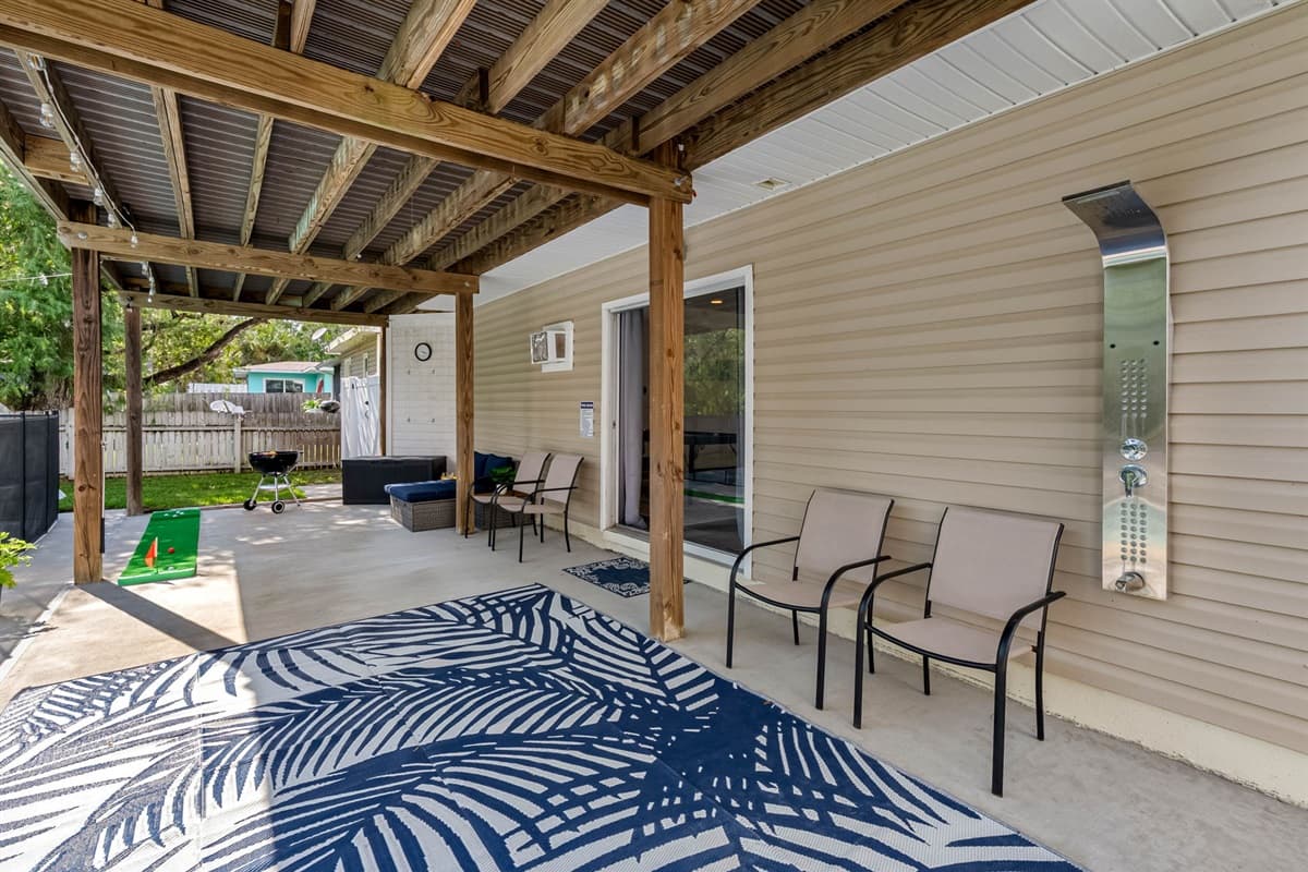 Covered and shaded, this patio offers year-round enjoyment, rain or shine.