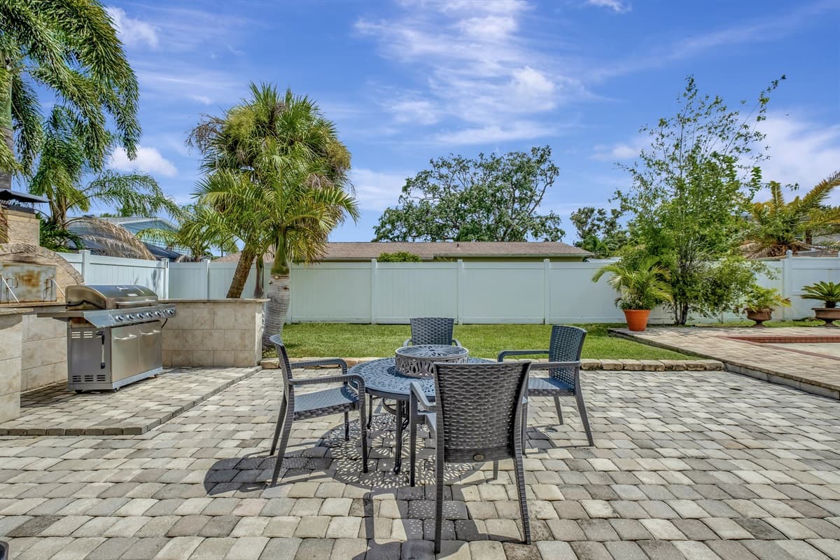Lounge amidst great seating options, all while enjoying the serene pool view.