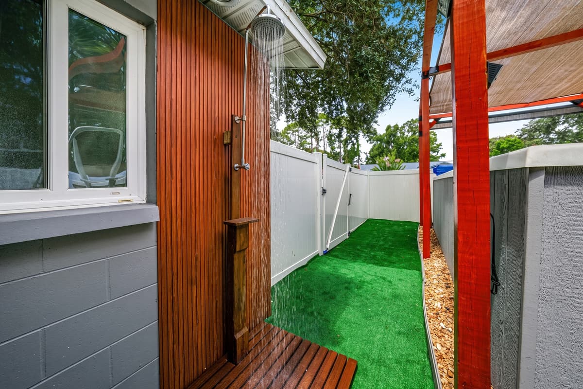 Freshen up with the private outdoor shower, thoughtfully located beside the swim spa for added convenience.