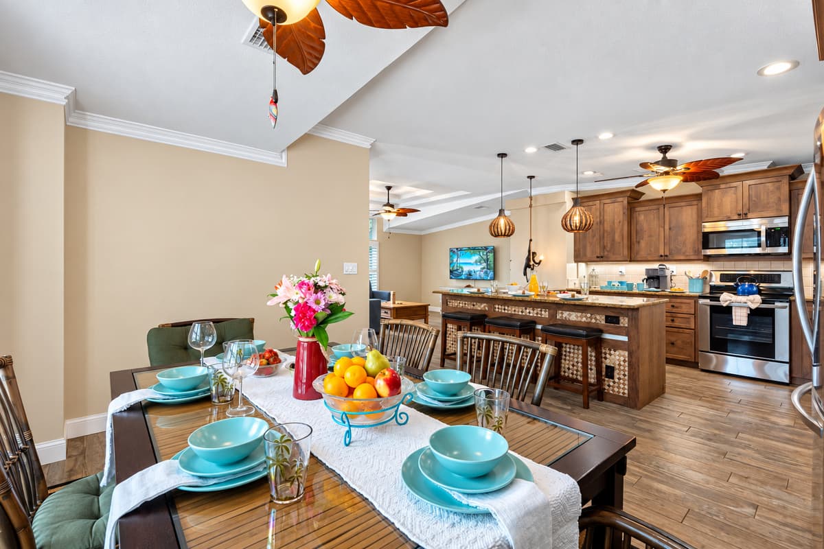 The dining area flows seamlessly into the kitchen, making serving meals easy and convenient.