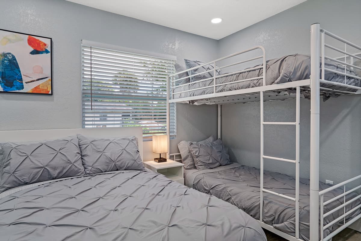 Magnificent bedroom with queen sized bed, single bunkbed, closets for storage and smart TV. Great room for families with kids or group of friends.