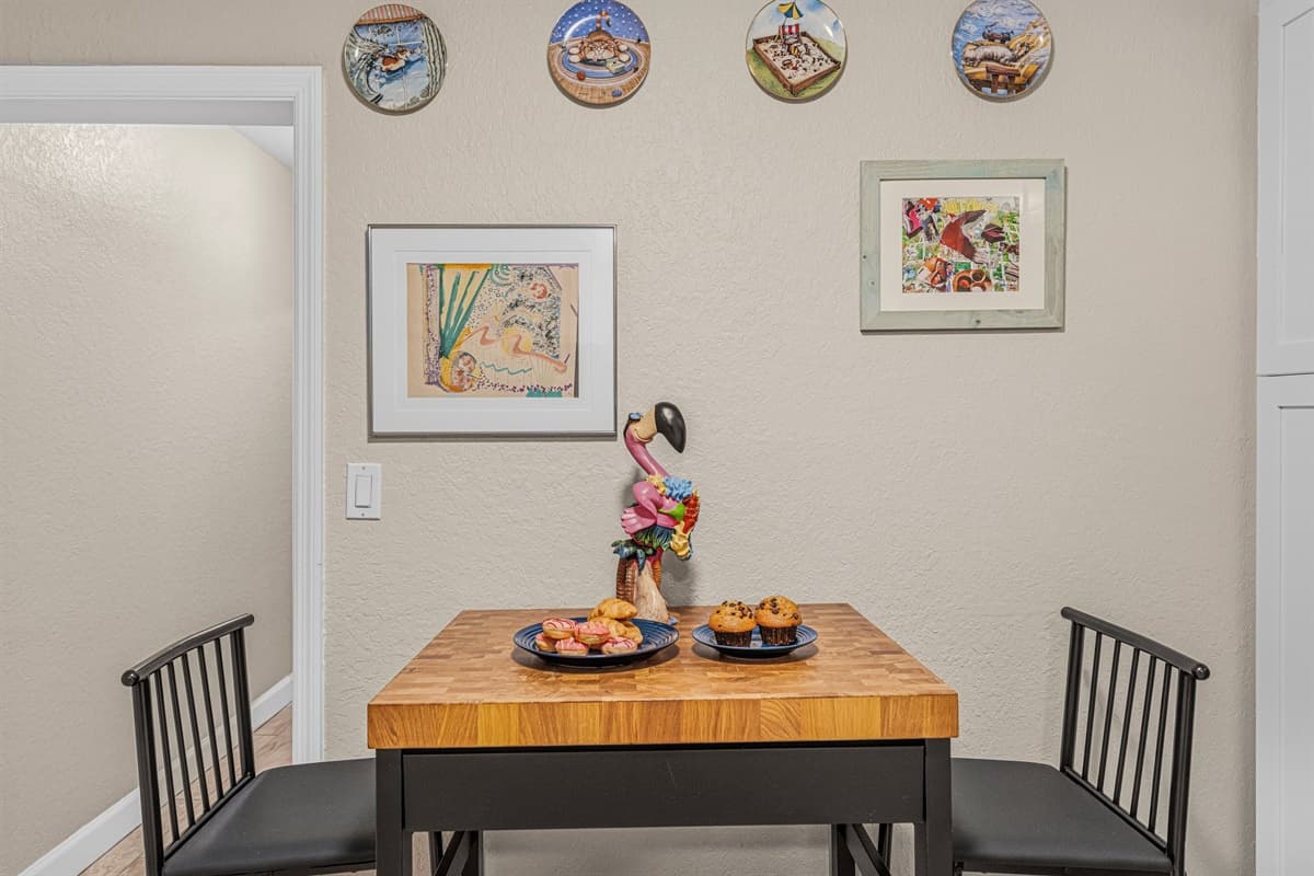 Charming dining nook with tasteful décor—great for intimate meals or morning coffee.