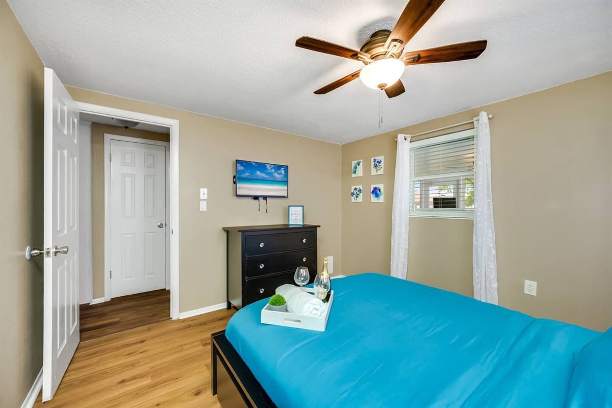 This spacious bedroom has a queen sized bed, smart TV, and drawers for storage. This bedroom will surely make your stay in this property the best among others.