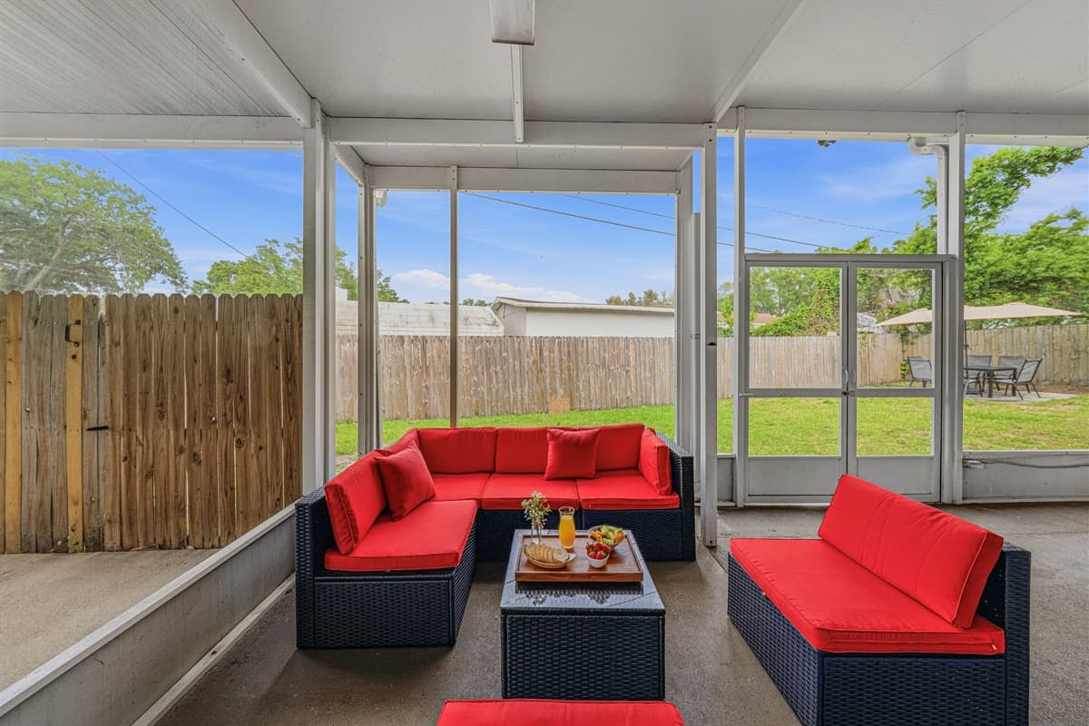 Spacious screened patio with lounge seating—perfect for relaxing evenings or morning coffee.