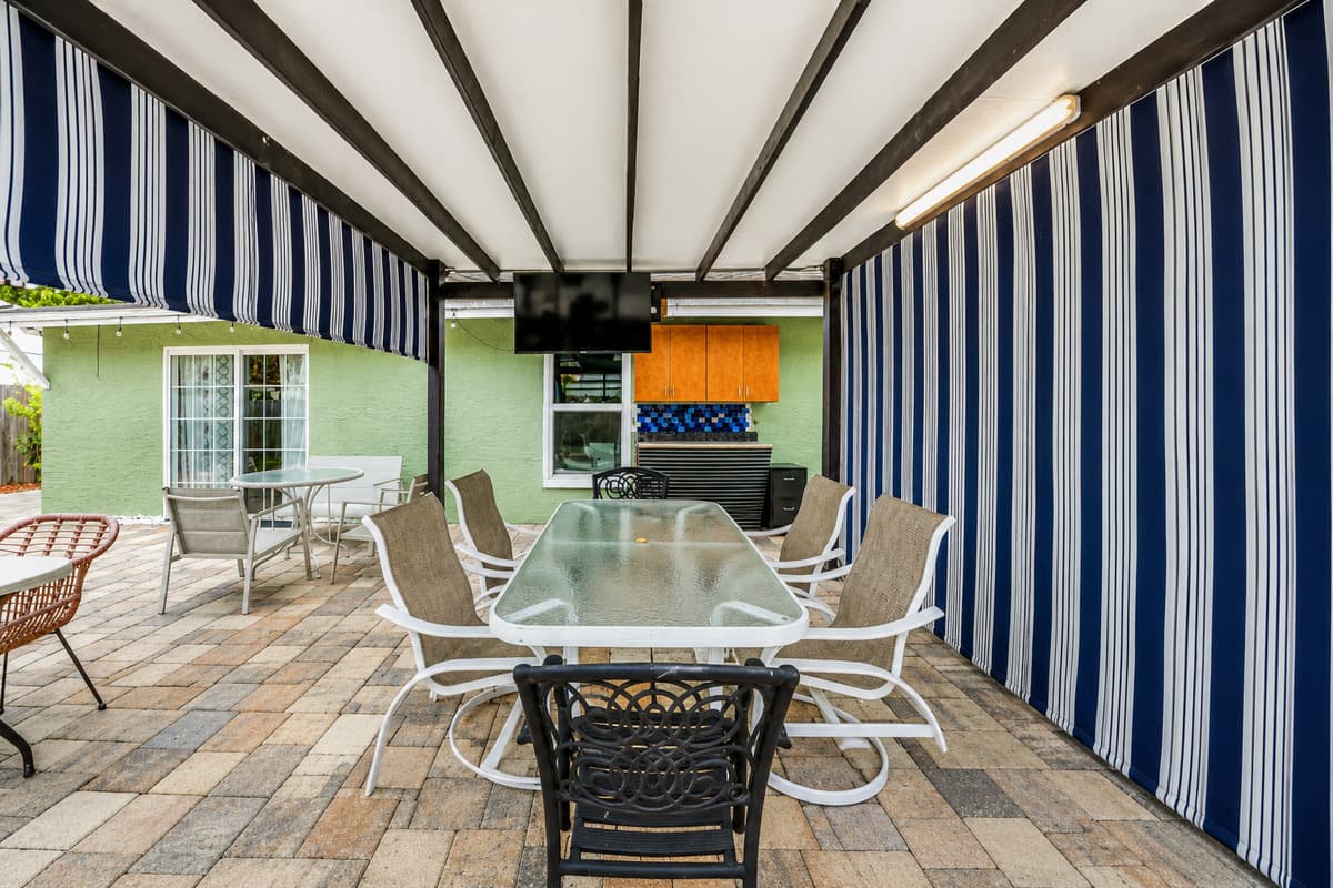 Enjoy meals outdoors under the shaded patio complete with dining seating and an outdoor TV.