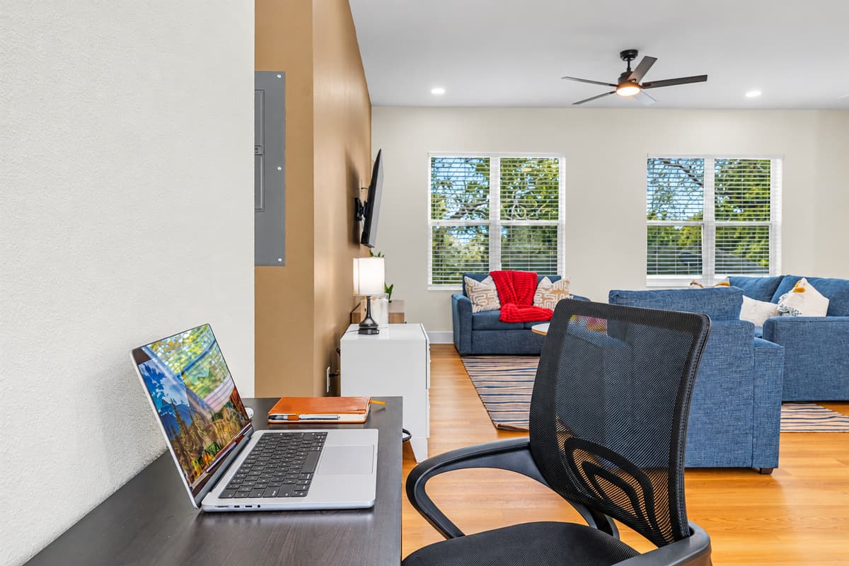 Answer emails with a view of the living room. A dedicated desk and mesh office chair with Wi-Fi, set right in the open living space. Close the laptop at 5 and you're already on the sofa: no commute, no hotel business center.