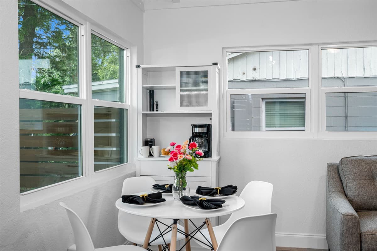 The table is perfectly sized to comfortably accommodate four diners, making it ideal for intimate family dinners, casual breakfasts, or entertaining guests.