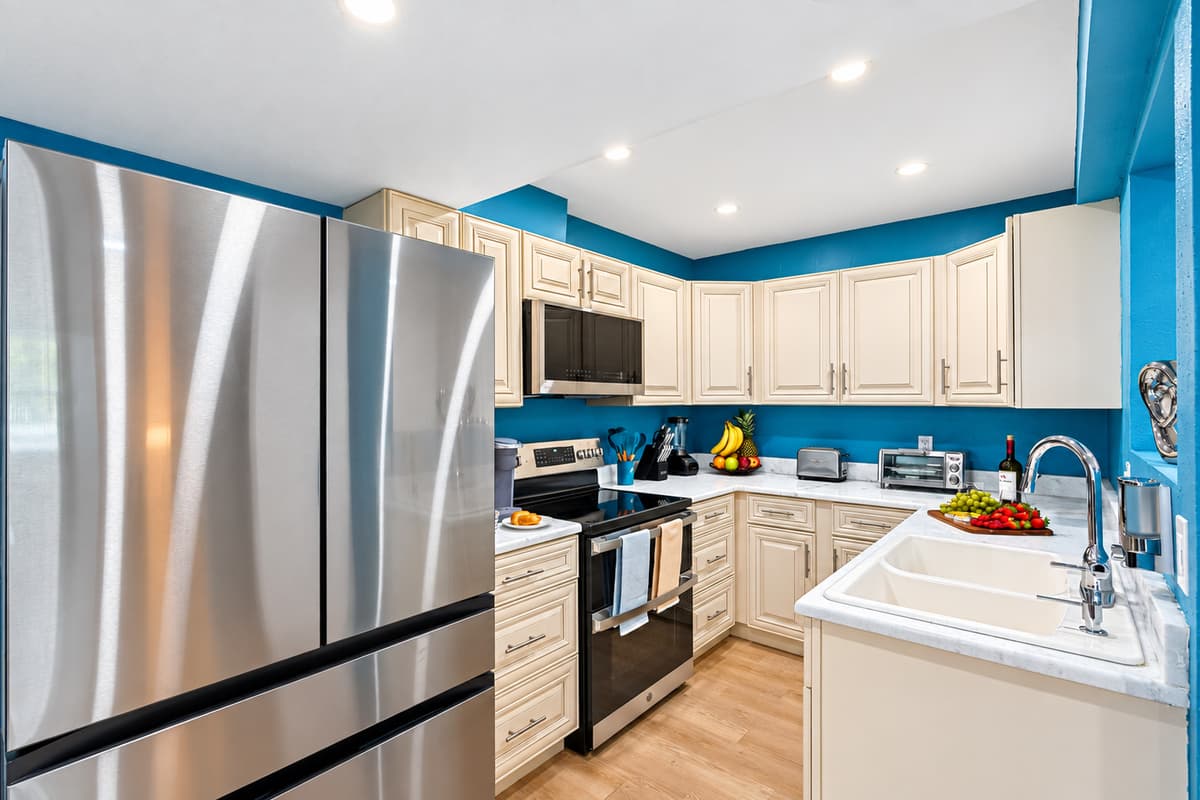 As you step into this captivating space, your eyes are immediately drawn to the enormous fridge, standing tall and proud, ready to store your culinary treasures.