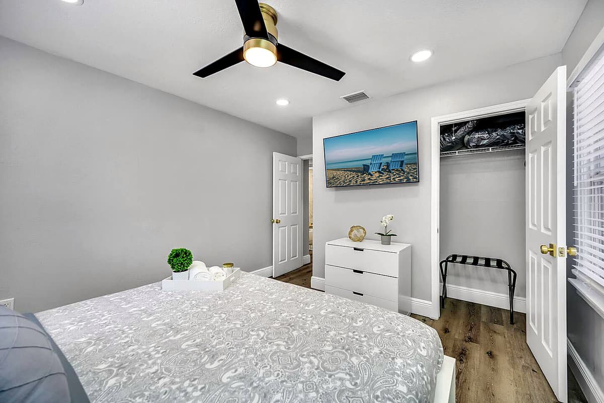 Elegant bedroom with a king-size bed, drawers, closet, and its own TV. Feel at home while you're on your home away from home! 