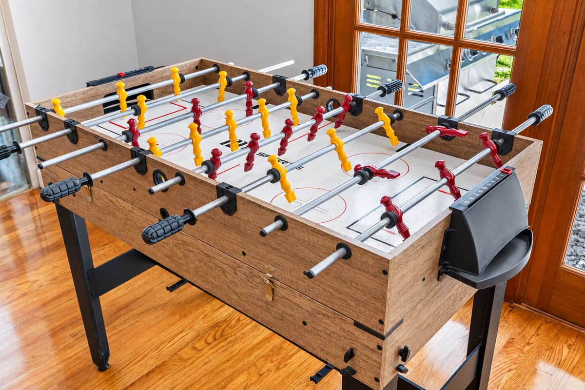 This game room features a foosball table, perfect for friendly matches and endless entertainment.