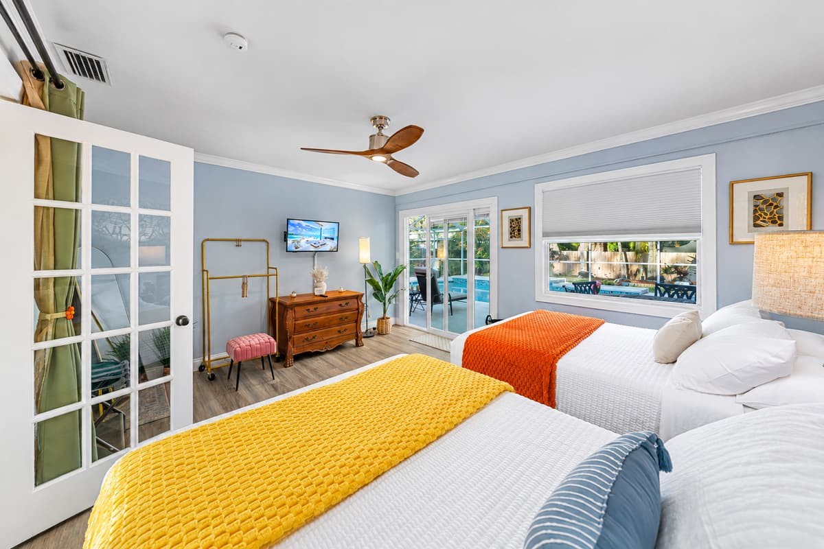 This thoughtfully designed bedroom features two double beds, providing comfort and flexibility for guests.