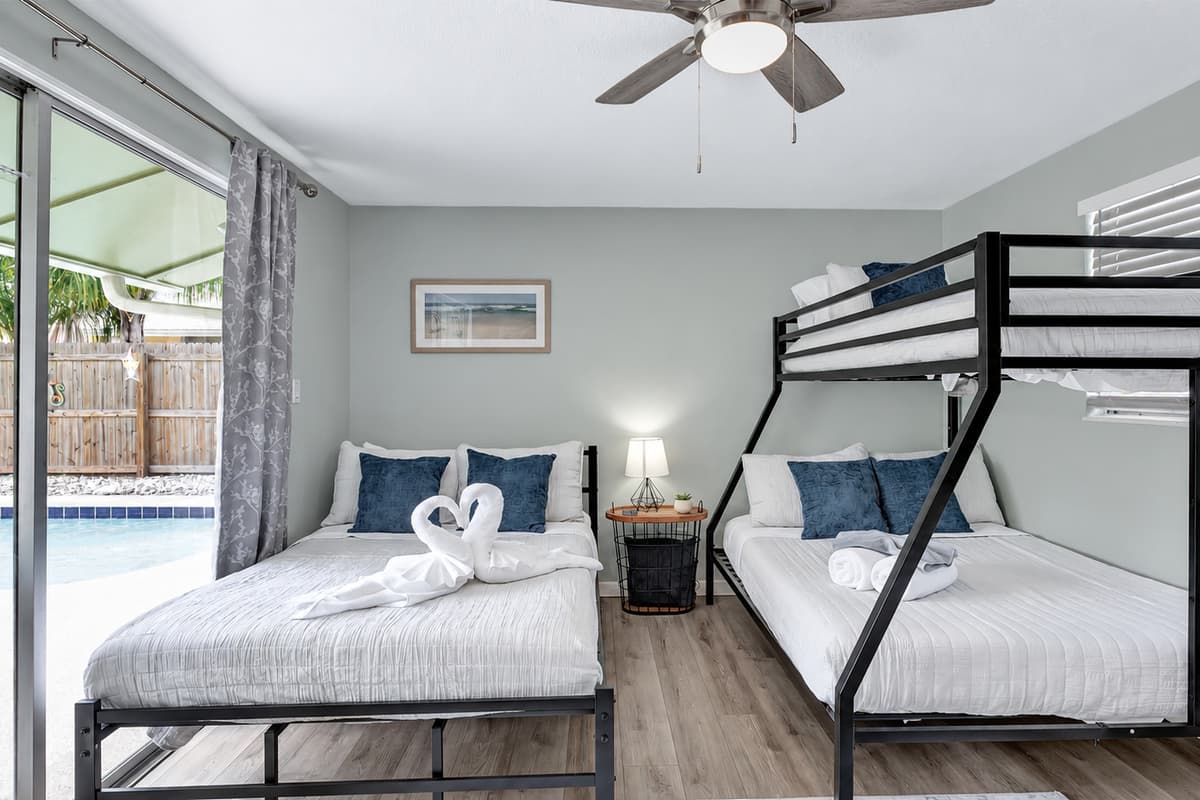 A queen-size bed invites you to unwind in comfort, while a bunk bed adds an element of adventure for those traveling with friends or family