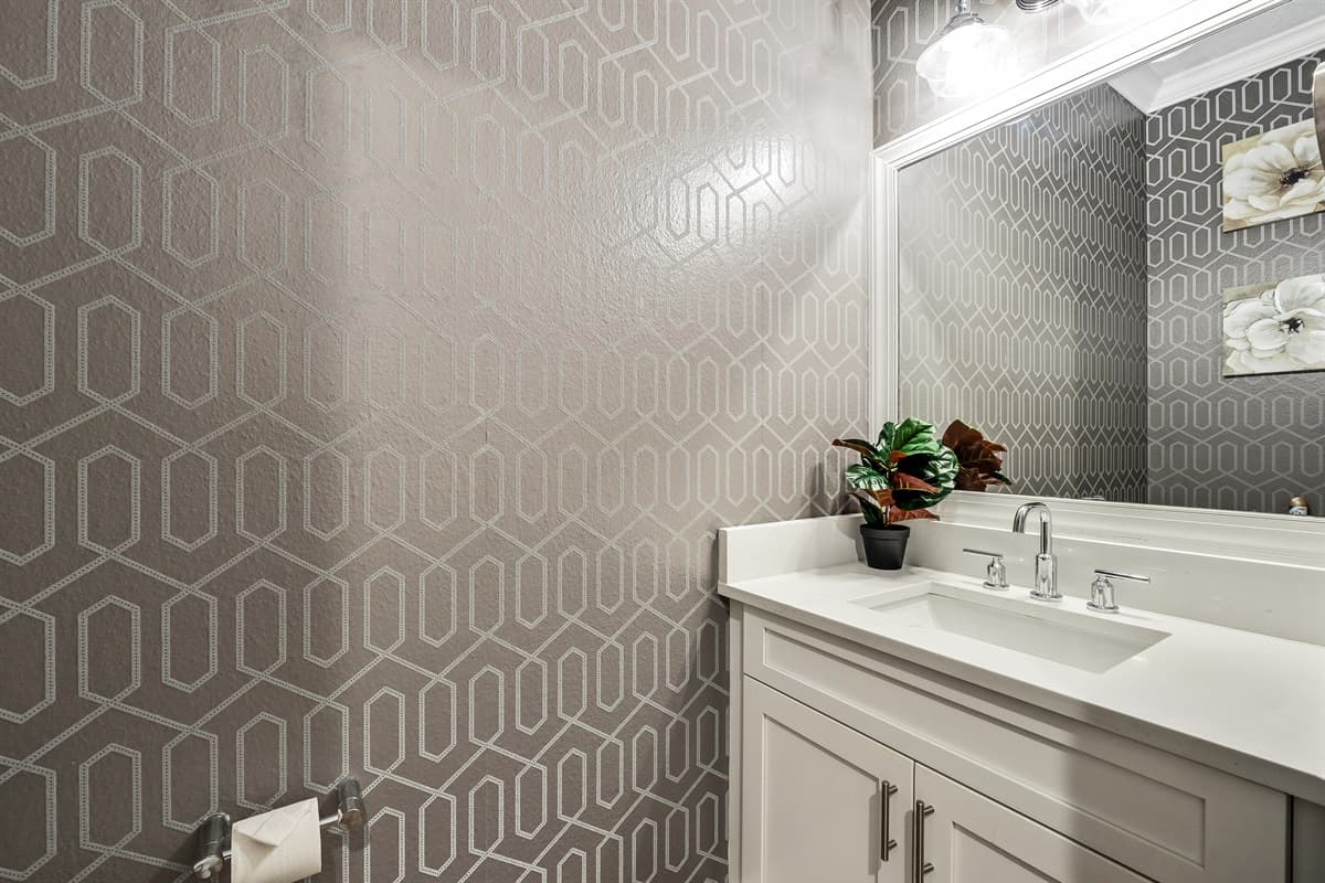 This half bathroom is perfect for guests who need a quick and convenient space to freshen up. 