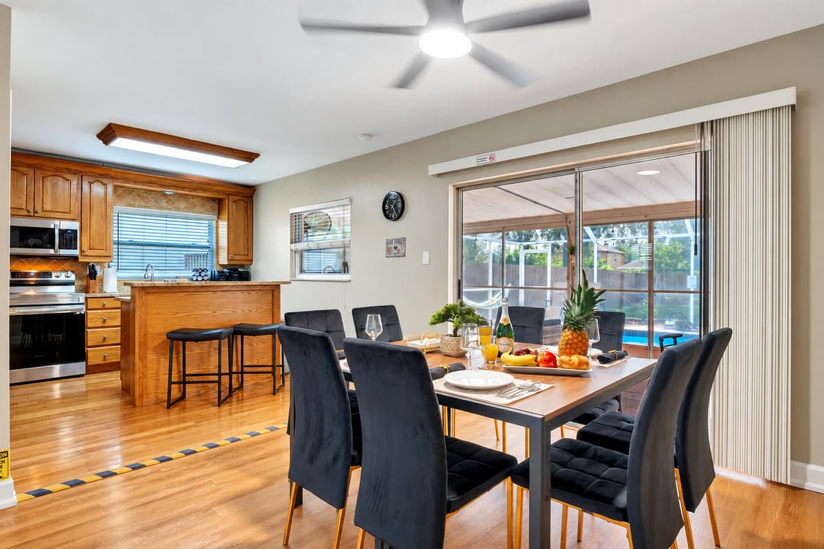 This dining area serves as the perfect hub for both delectable meals and effortless indoor-outdoor living.
