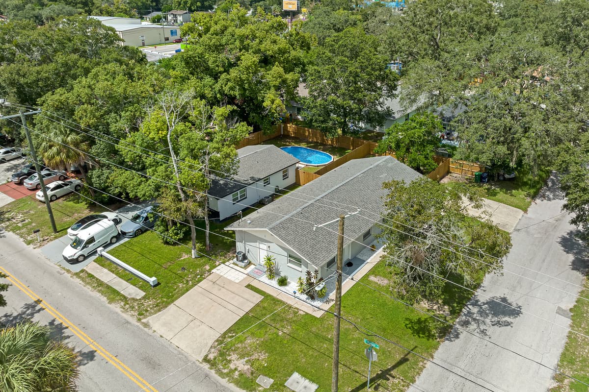 Breathtaking aerial front view of our eautiful property and the safe and wonderful neighborhood. Enjoy the view outside showcasing beautiful properties in the area. Book this property now!