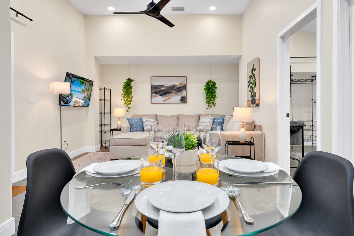 Dinner your way, on your schedule. Glass table, comfortable chairs and the lounge right behind — small enough to feel private, close enough that nobody misses what's happening outside.