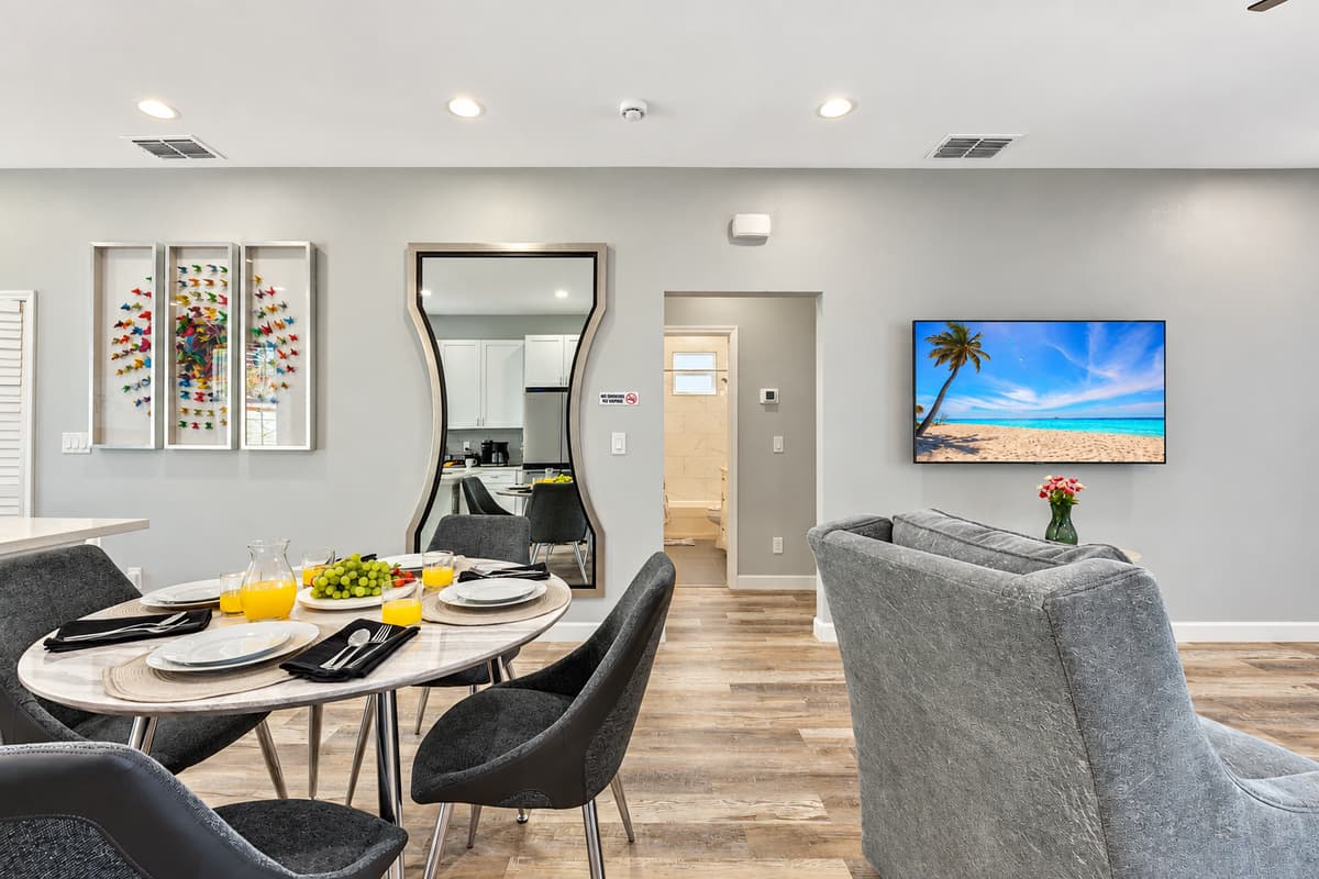 The dining room is a study in understated sophistication, with minimalist design elements that allow the beauty of the space to speak for itself.