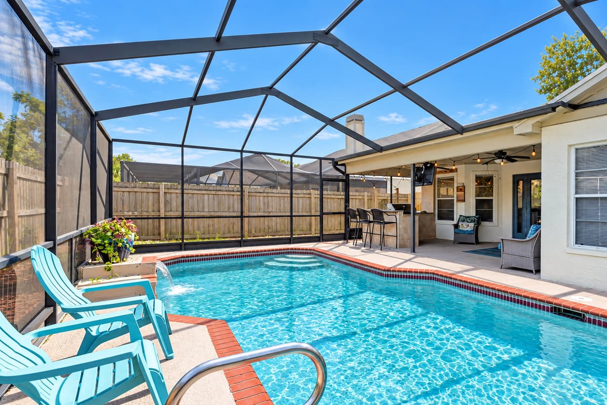 Relaxation and enjoyment awaits beneath the shelter of our inviting screened pool area.