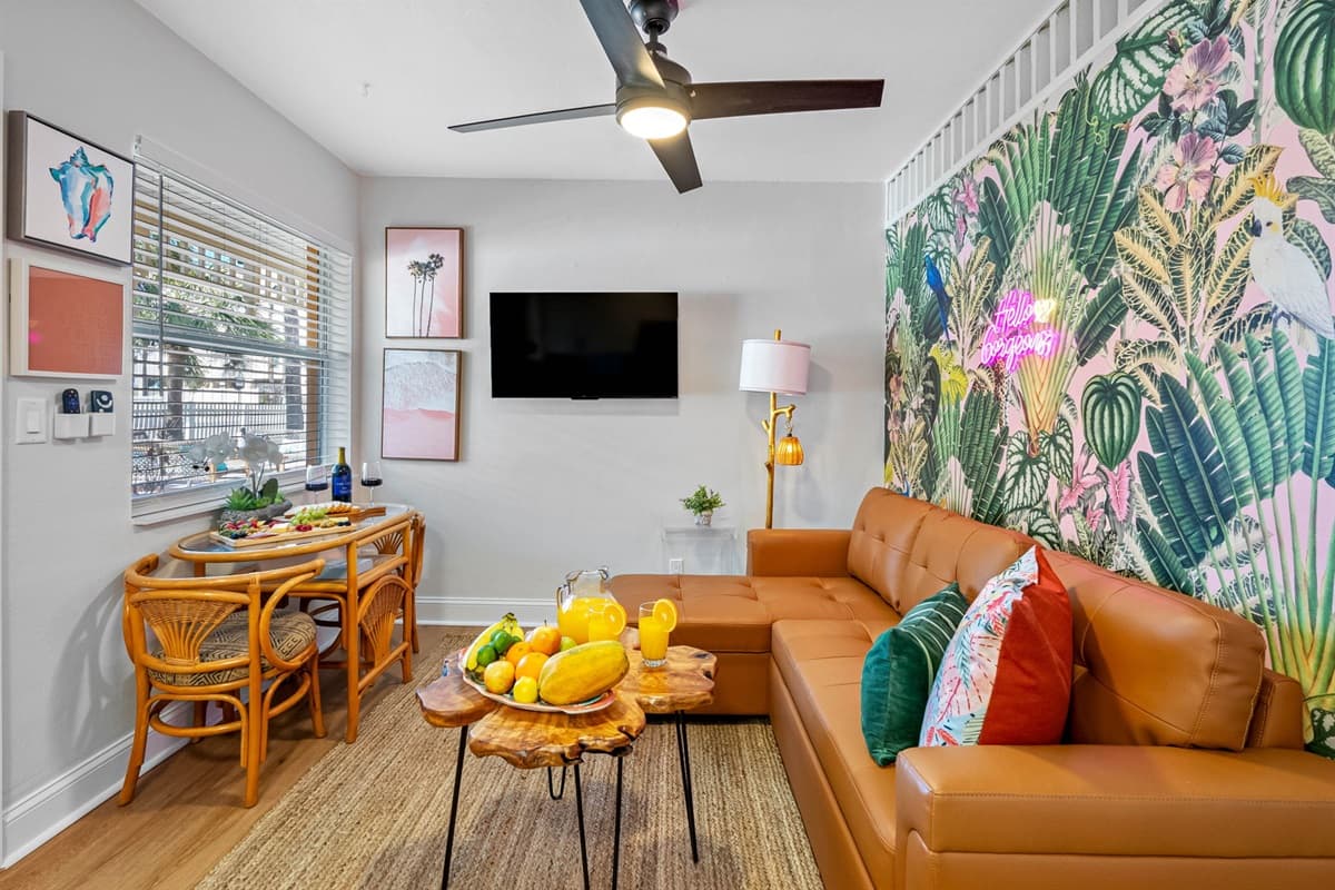 From palm-frond prints to sun-kissed hues, this living space is a curated oasis!