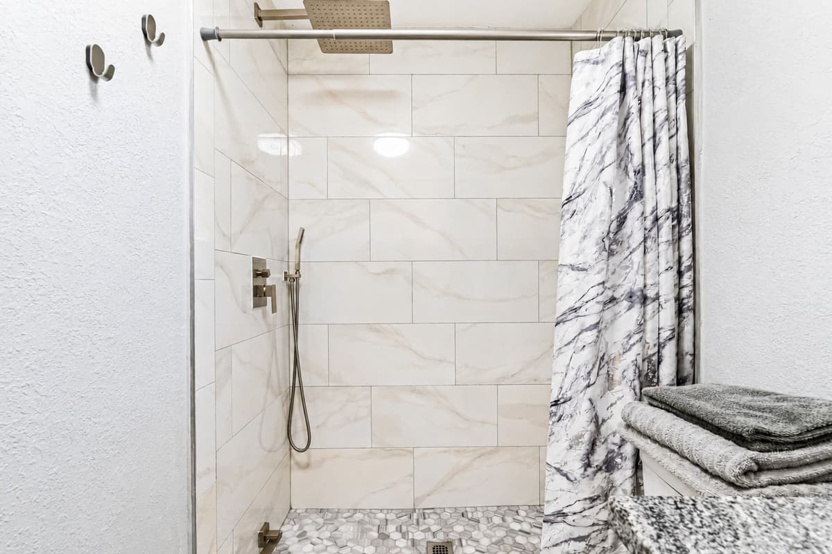 The combination of neutral tones and modern finishes creates a timeless and versatile space that will appeal to even the most discerning traveler.