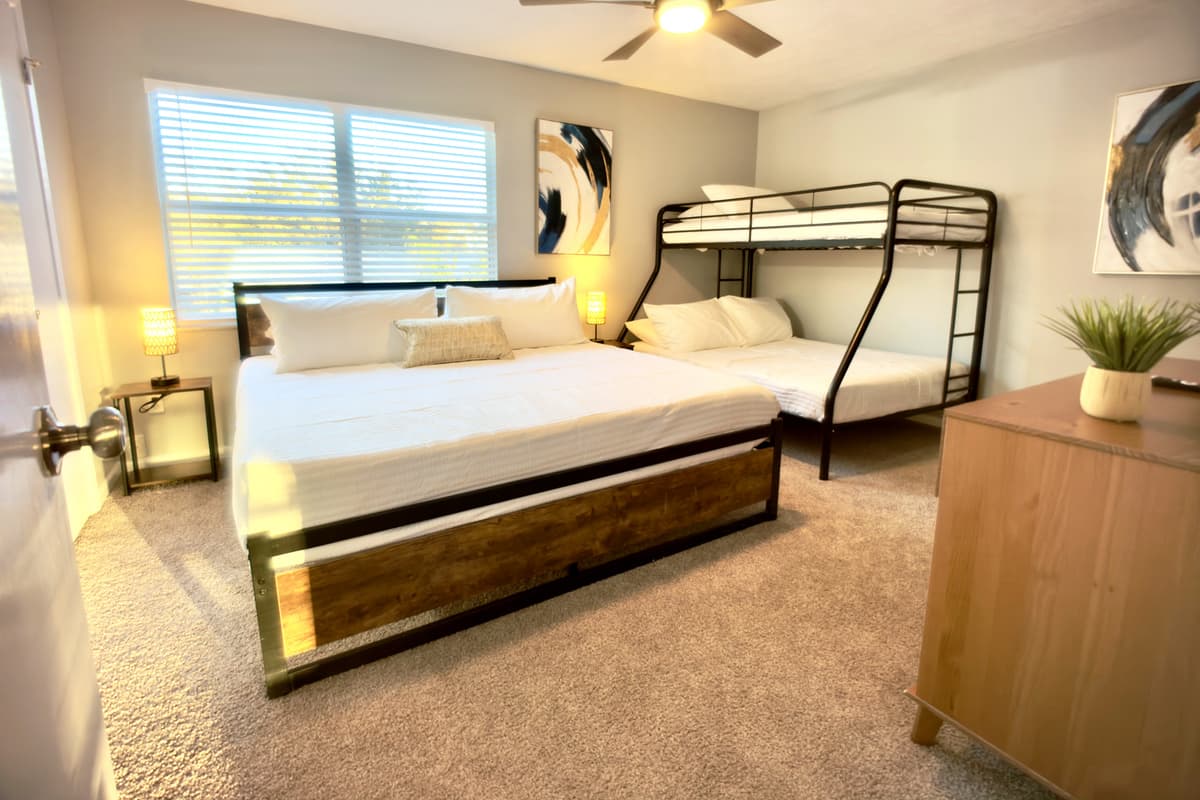 Equipped with a queen-size bed and a bunk bed, this room is perfect for kids, friends, or extra guests.