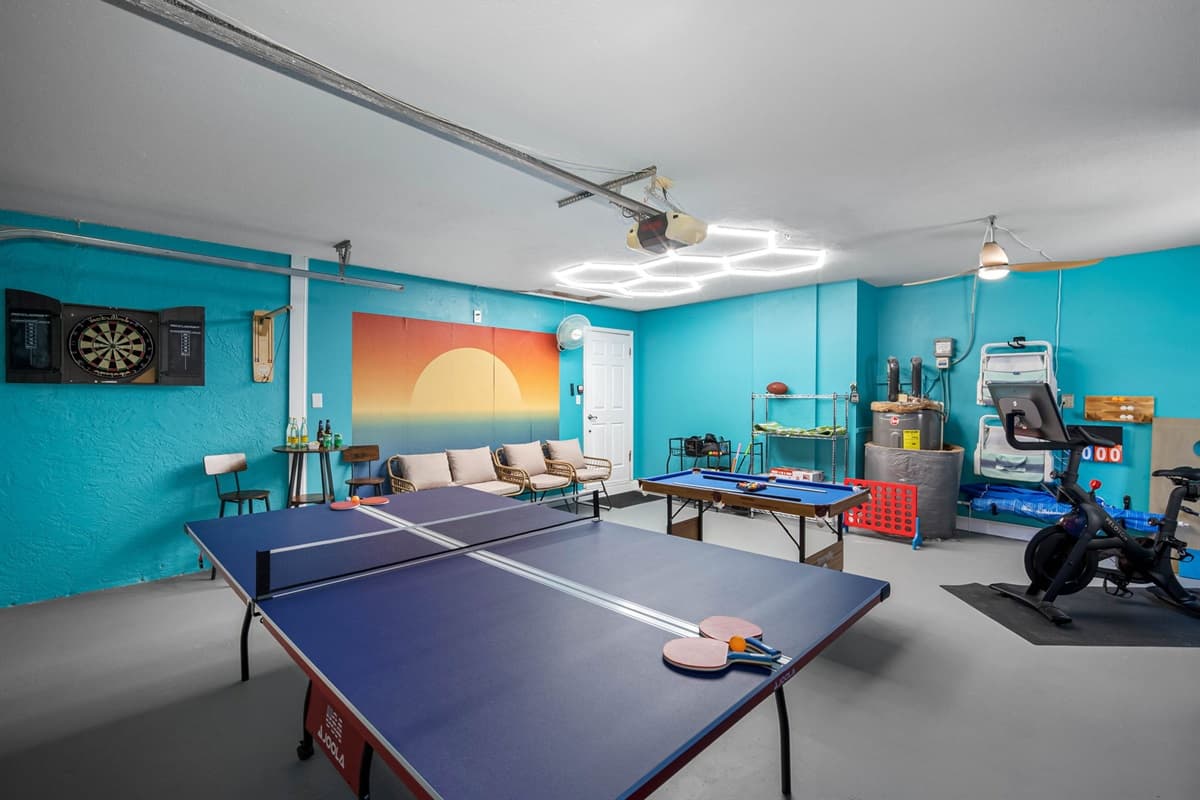 A bright, beachy game room complete with games, seating, and vibrant décor for the perfect indoor escape.
