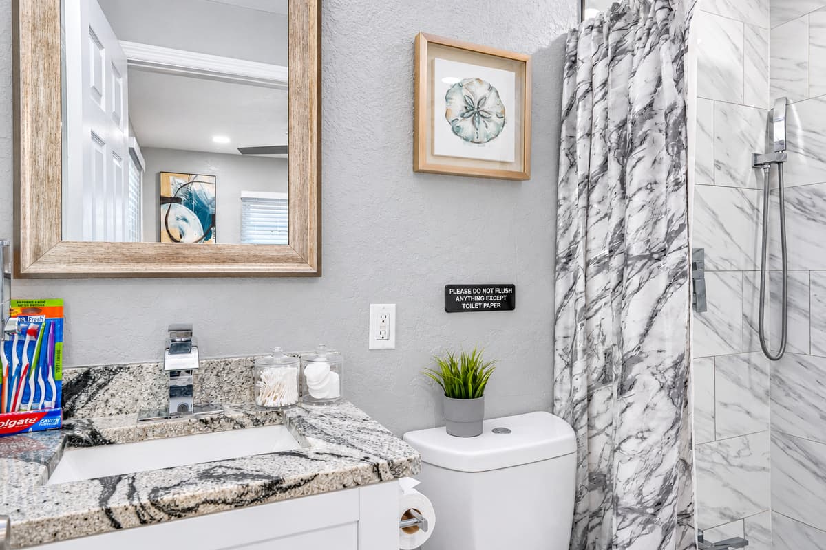 Granite vanity, fresh toiletries. A granite-topped vanity, framed mirror, and starter toiletries ready for your arrival. Skip the first-night store run.