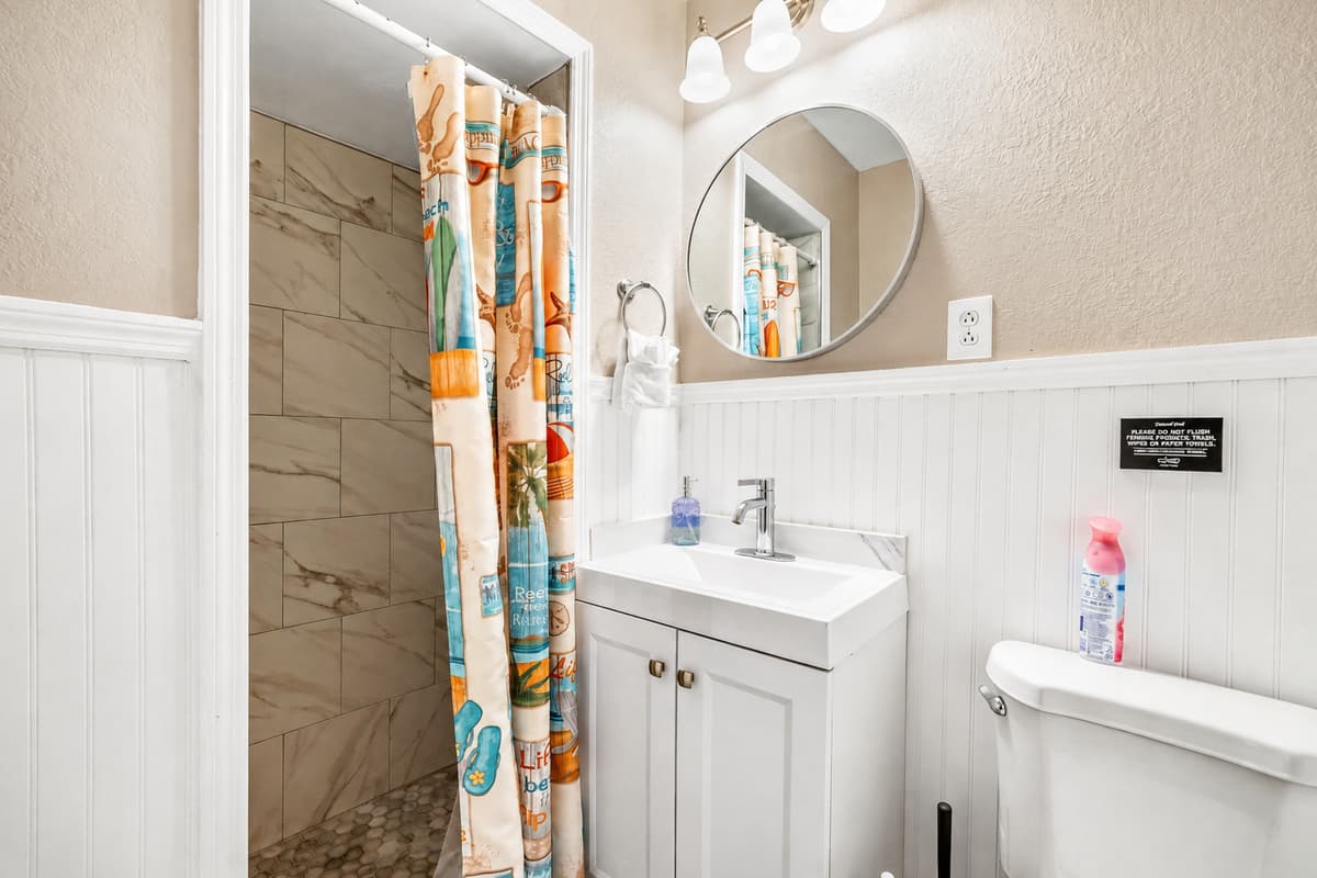 Surrounded by tasteful tiles and adorned with thoughtful accents, the bathtub is not just a fixture but a statement of luxury.