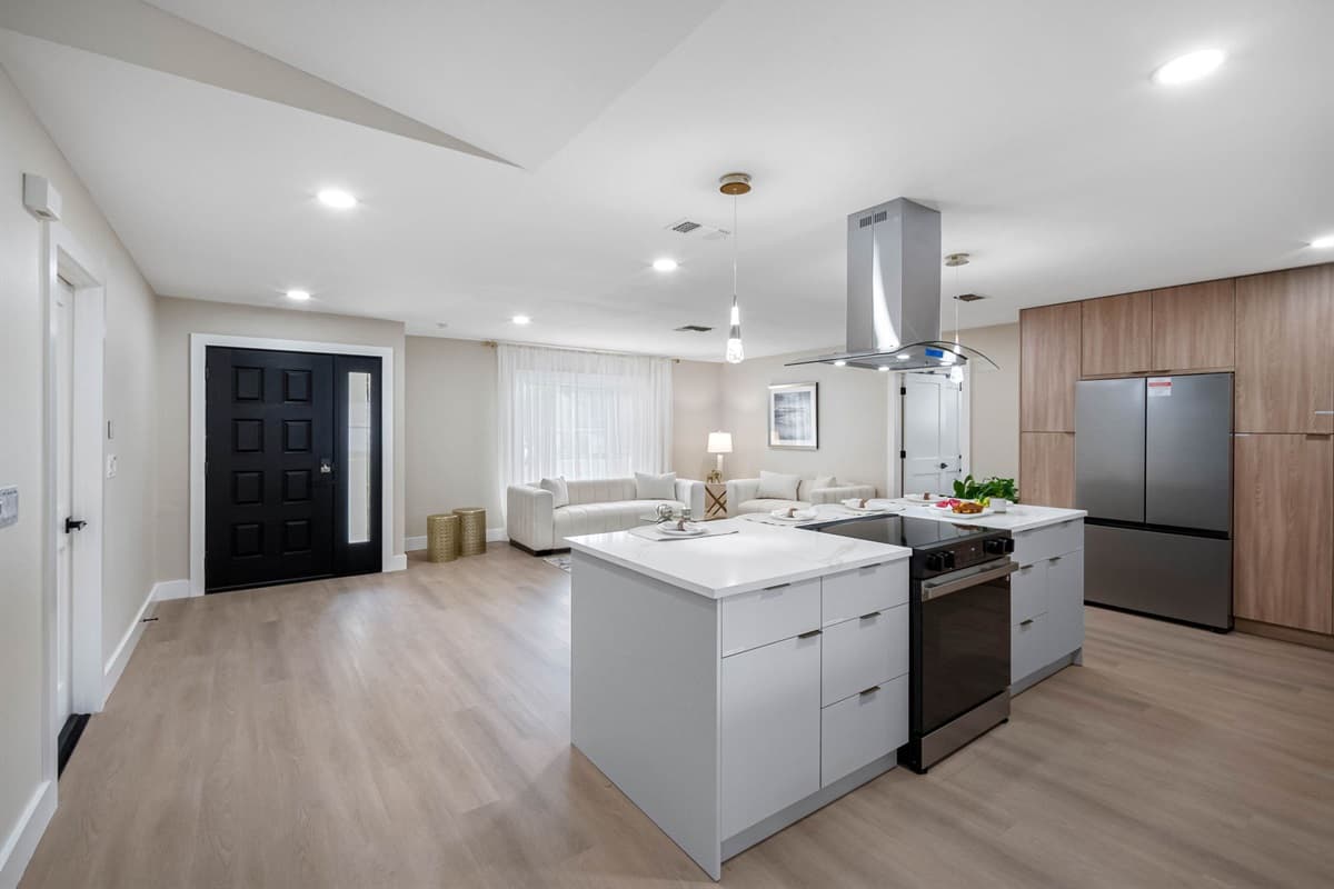 A beautifully designed kitchen that flows naturally into the living and dining areas.