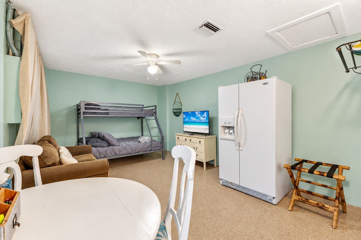The centerpiece of the room is the cozy twin-size bed, promising a haven of relaxation and rest.