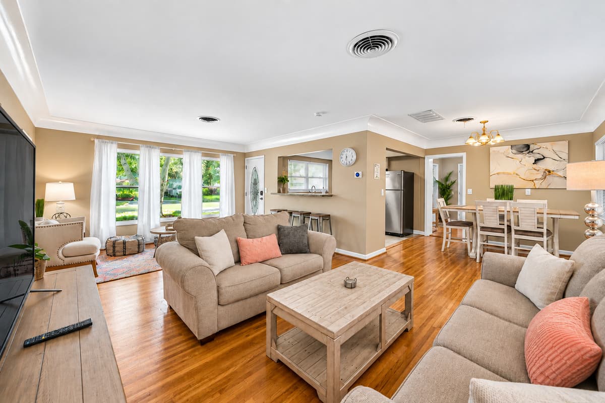 Inviting family room with modern furnishings and a seamless flow into the kitchen and dining spaces.