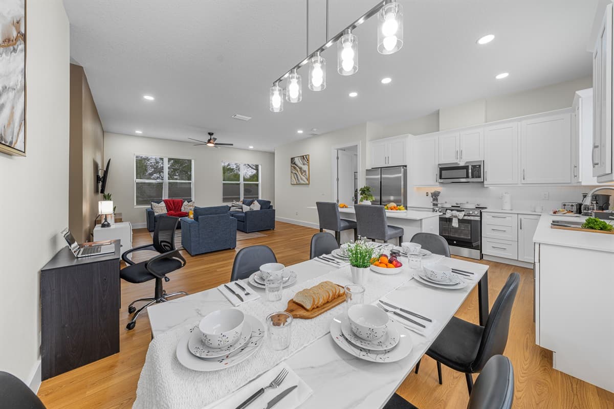 Spacious dining area flowing into open-concept kitchen and living space.