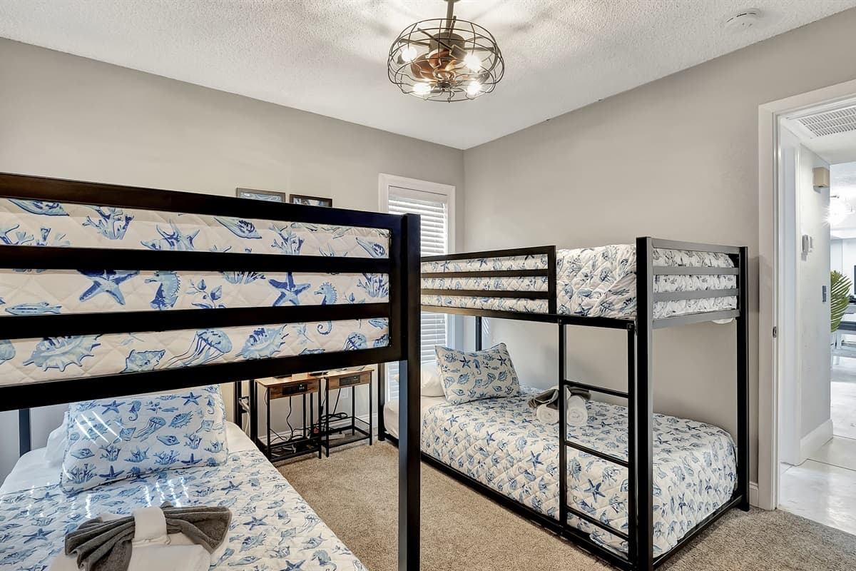 This cozy bedroom is tailor-made for a perfect family retreat or a memorable getaway with friends.