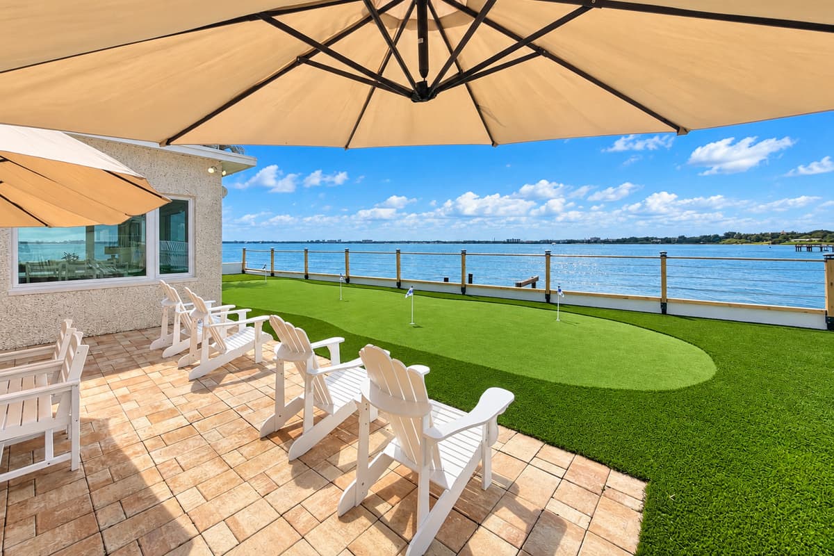 Waterfront patio with outdoor dining and places to relax.