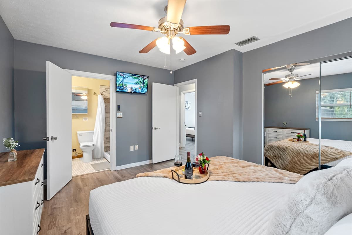 Relax in this spacious king bedroom with a private en-suite bathroom, designed for comfort and privacy.