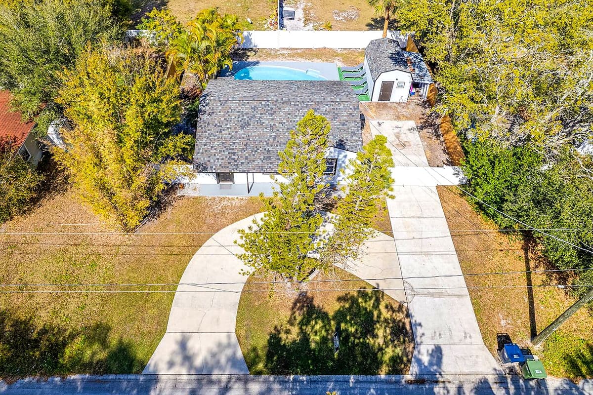 Aerial front view of the house showcasing the lovely driveway where you can park
