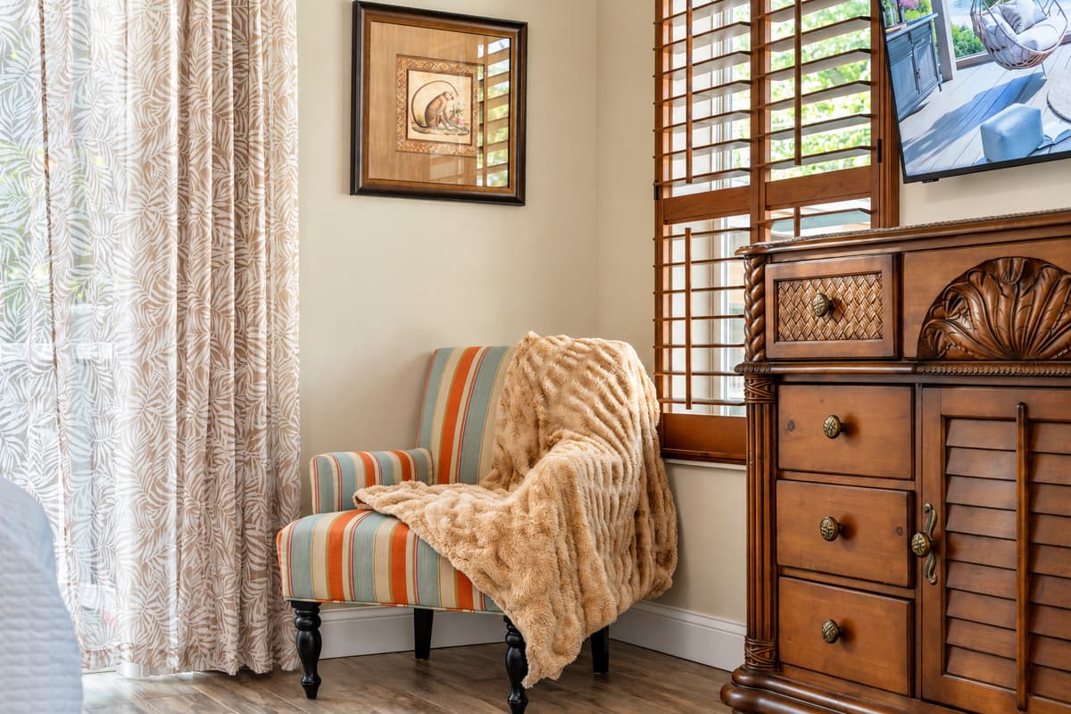 The master suite includes a cozy sitting area—perfect for reading, relaxing, or enjoying your morning coffee.