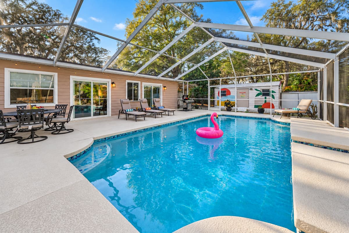 Enjoy seamless indoor-outdoor living with sliding glass doors leading to the expansive lanai and beautifully maintained pool area.