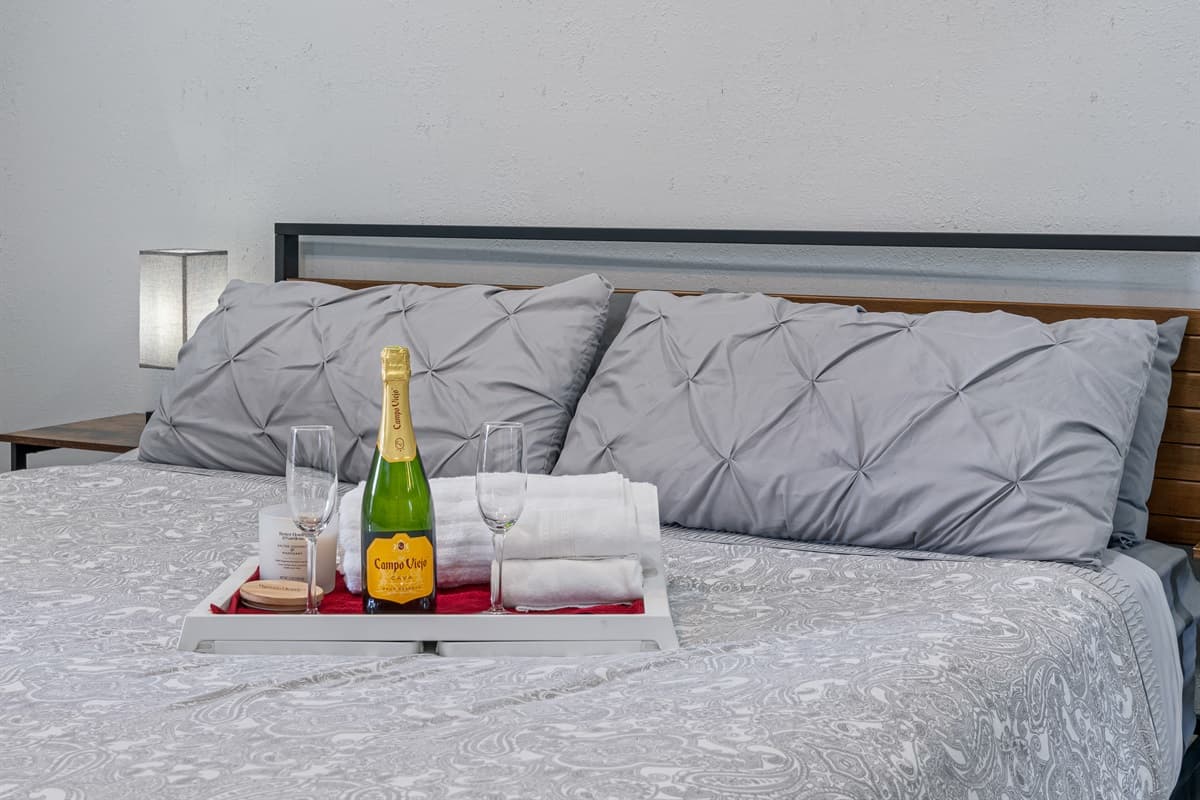 Have the best sleep during your stay in your your home away from home! This incredible bedroom has a king-sized bed, full-sized mirror closet, drawers, bed side tables and lamps, and a bathroom! Book this property now!