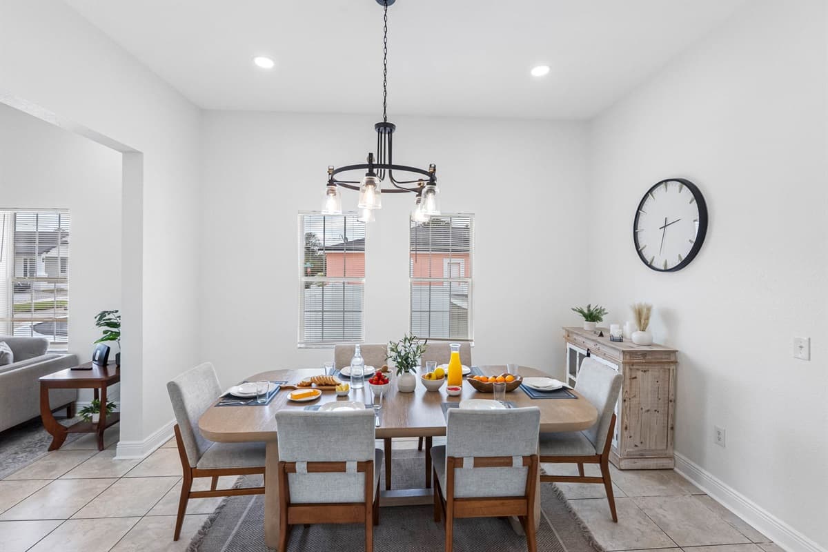 The dining area combines modern style with functionality, providing a pleasant space for dining and conversation.