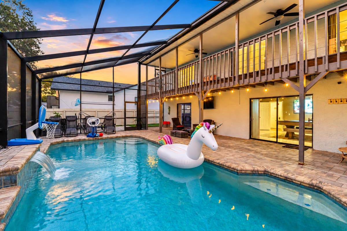 From the tropical vibe to the playful inflatables and water features, this backyard pool is as Insta-worthy as it is refreshing.